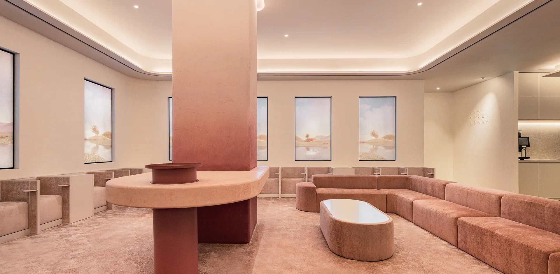 GU Clinic lounge with rose-pink sofas and artwork